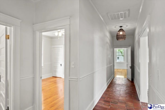 701 S Coit St, Florence, SC 29501 - corridor with brick flooring and crown molding