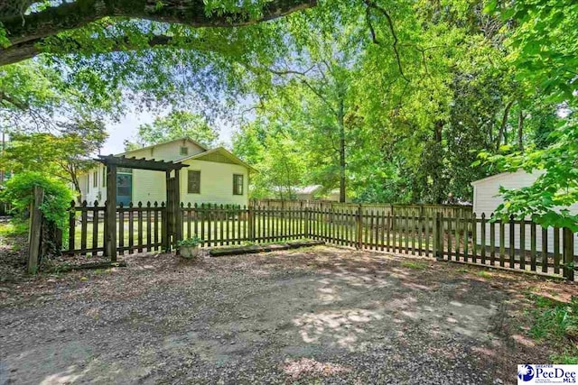 701 S Coit St, Florence, SC 29501 - fenced front yard featuring a pergola