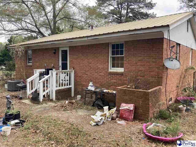 606 Curry St, Dillon, SC 29536 - exterior space featuring central AC unit