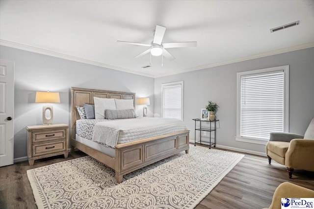 bedroom with multiple windows, crown molding, and light hardwood / wood-style floors