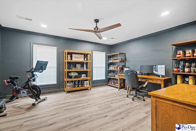 home office featuring crown molding, ceiling fan, and light hardwood / wood-style floors