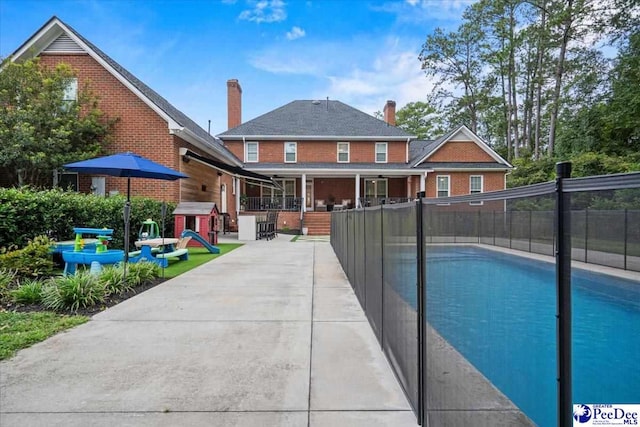 view of pool featuring a patio area