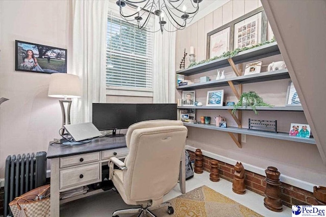 home office with radiator and a notable chandelier