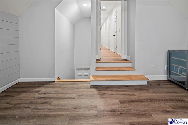 stairs featuring hardwood / wood-style flooring