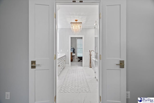 hallway with a chandelier