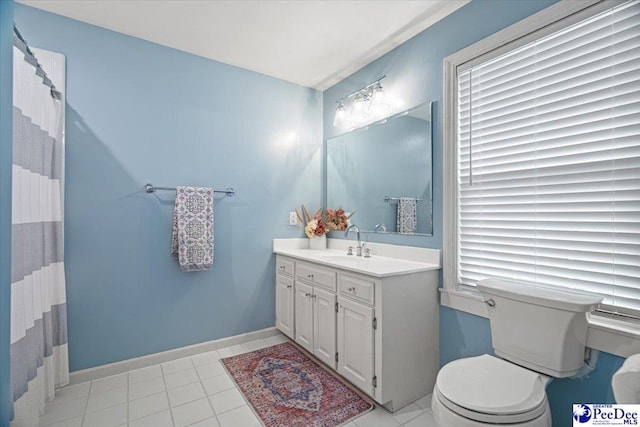 bathroom with tile patterned flooring, vanity, curtained shower, and toilet