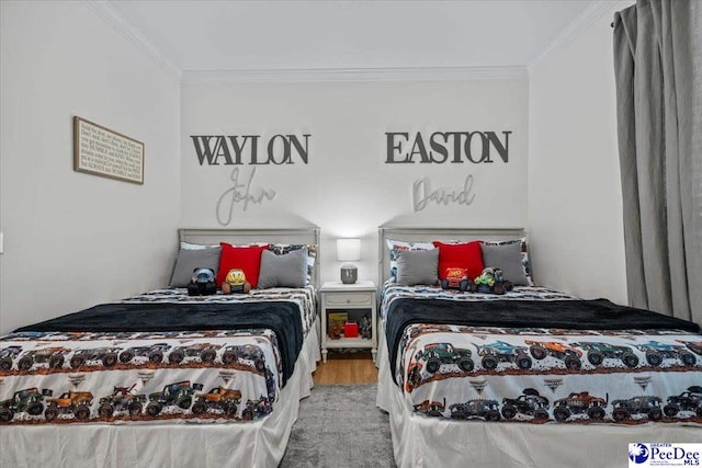 bedroom featuring crown molding and wood-type flooring