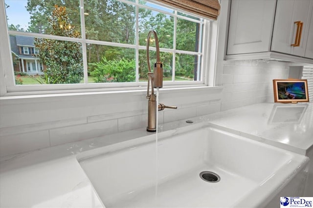 details with sink and light stone countertops