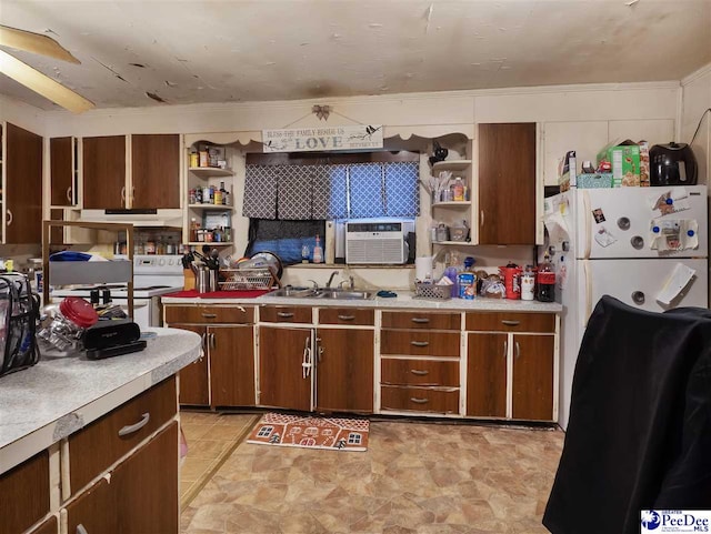 kitchen featuring white refrigerator, sink, and cooling unit