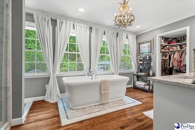 965 Scriven Dr, Flornce, SC 29501 - dining space with ornamental molding, a chandelier, wood finished floors, baseboards, and recessed lighting