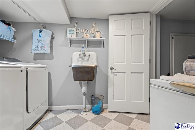 965 Scriven Dr, Flornce, SC 29501 - laundry area featuring washer and dryer, light flooring, and baseboards