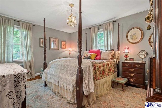 965 Scriven Dr, Flornce, SC 29501 - bedroom featuring multiple windows and light wood-type flooring