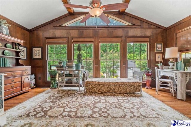 965 Scriven Dr, Flornce, SC 29501 - interior space featuring lofted ceiling, a ceiling fan, wood finished floors, and wooden walls