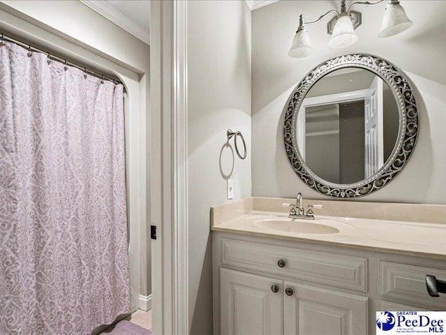 bathroom featuring vanity and crown molding