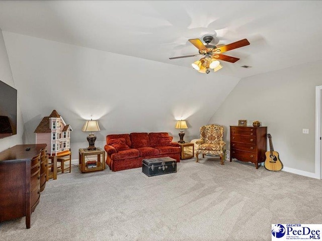 carpeted living room featuring lofted ceiling, baseboards, visible vents, and a ceiling fan