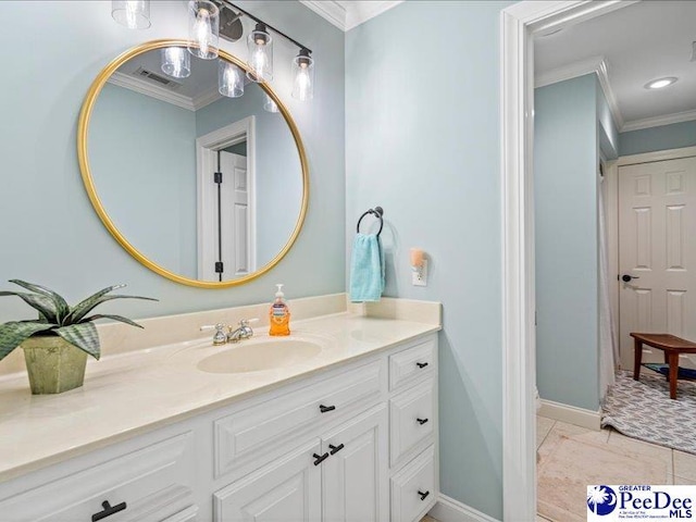 bathroom featuring baseboards, visible vents, crown molding, and vanity