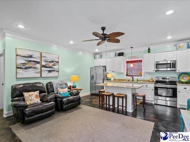 living room featuring ornamental molding, recessed lighting, and baseboards