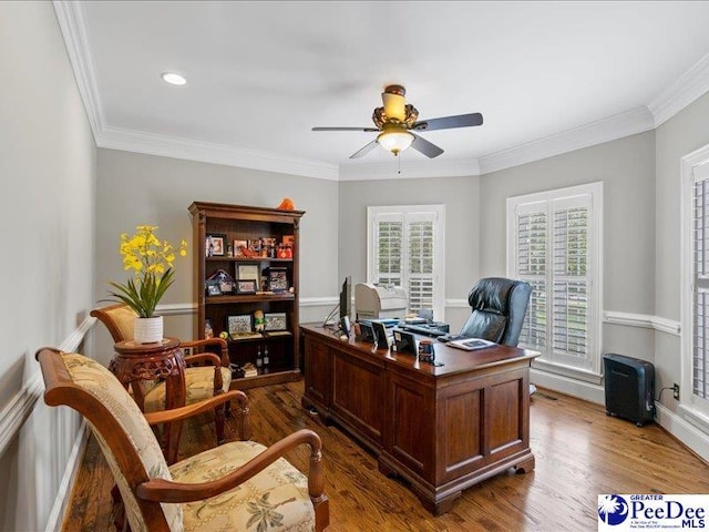 home office featuring ceiling fan, crown molding, and wood finished floors