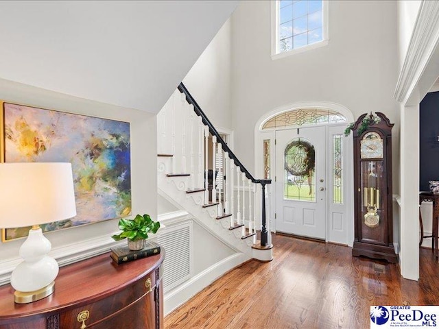 entryway featuring stairs and wood finished floors