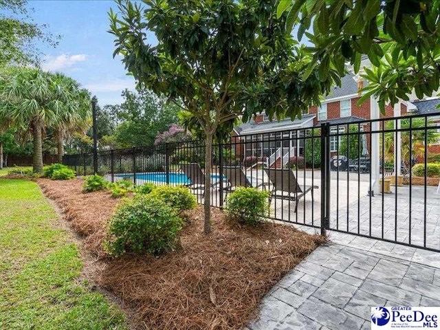 exterior space featuring fence and a pool