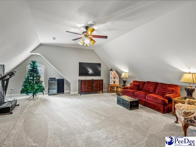 carpeted living area with baseboards, vaulted ceiling, and a ceiling fan