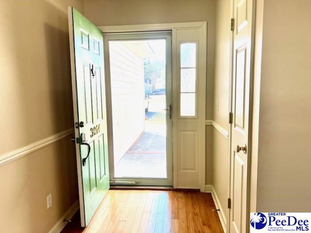3014 Longfellow Dr, Florence, SC 29505 - doorway with light wood-type flooring