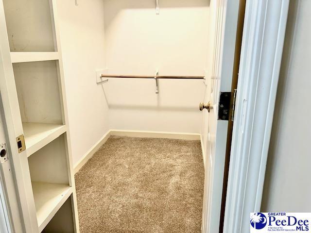 3014 Longfellow Dr, Florence, SC 29505 - spacious closet featuring light colored carpet