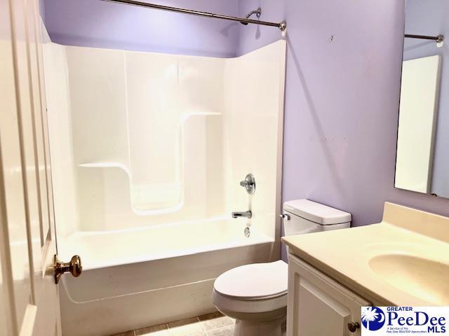3014 Longfellow Dr, Florence, SC 29505 - full bathroom featuring vanity, toilet, and  shower combination