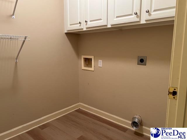 3014 Longfellow Dr, Florence, SC 29505 - washroom with cabinets, hardwood / wood-style floors, hookup for an electric dryer, and washer hookup