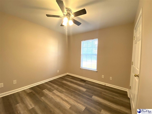 unfurnished room featuring dark hardwood / wood-style floors and ceiling fan