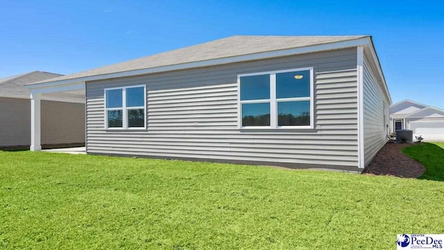 view of property exterior featuring a lawn and central air condition unit