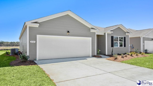 single story home featuring central AC unit, a garage, and a front yard