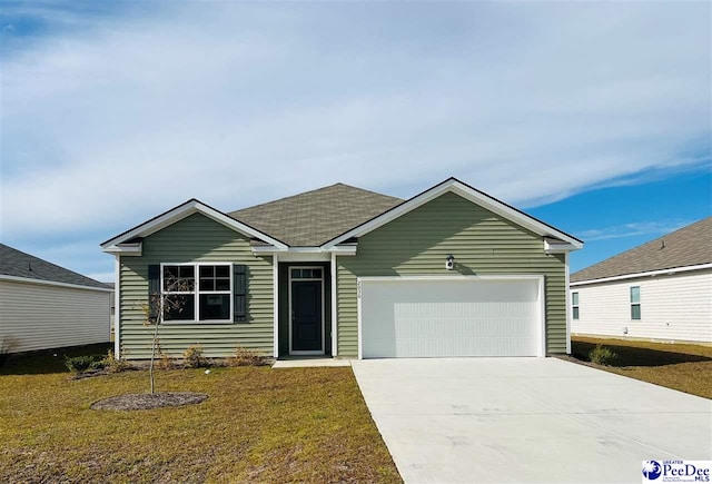 view of front facade with a garage and a front yard