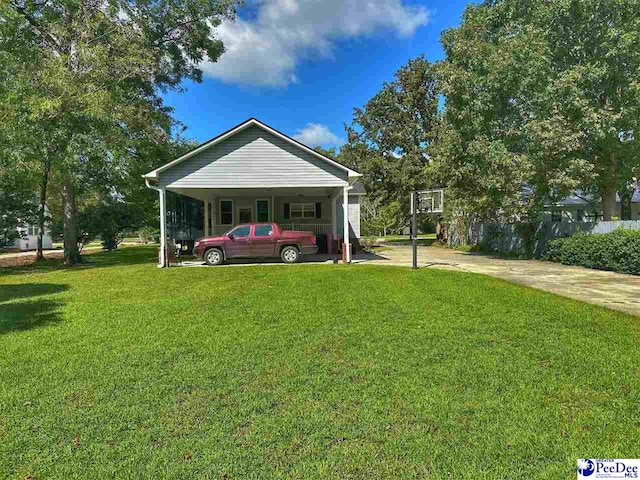 exterior space featuring a carport and a front yard