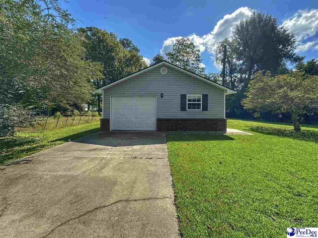 view of property exterior with a yard