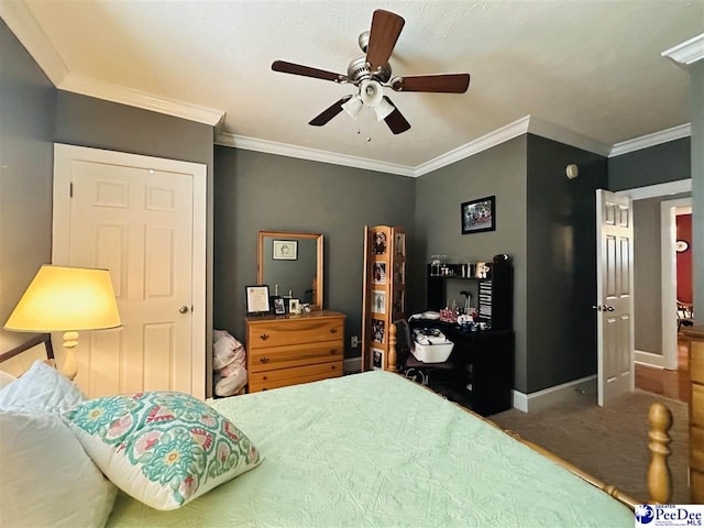 bedroom featuring crown molding, ceiling fan, and carpet floors