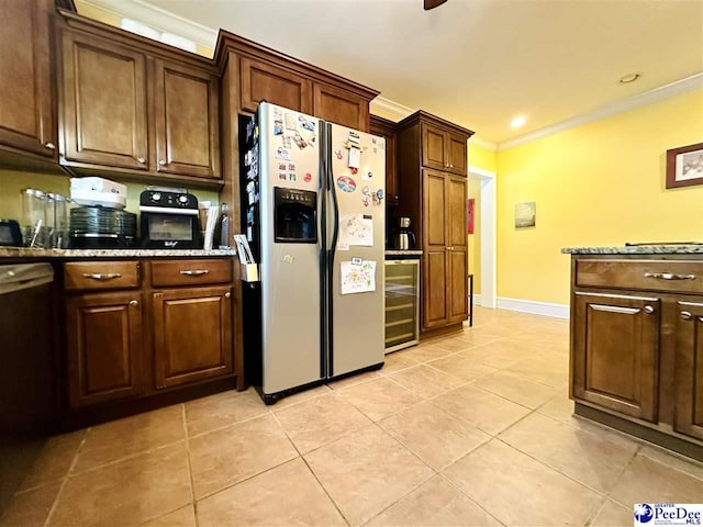 kitchen with light tile patterned floors, crown molding, stainless steel fridge, light stone counters, and beverage cooler