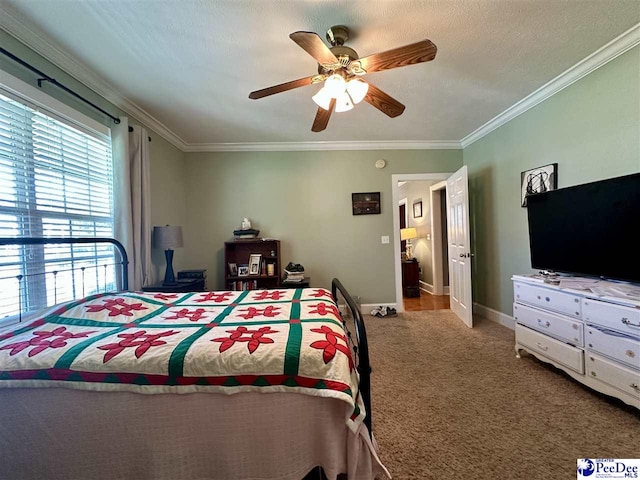 bedroom with crown molding, carpet, a textured ceiling, and ceiling fan