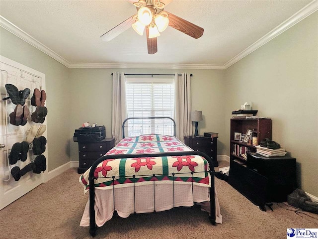 bedroom with ornamental molding, a textured ceiling, and carpet flooring