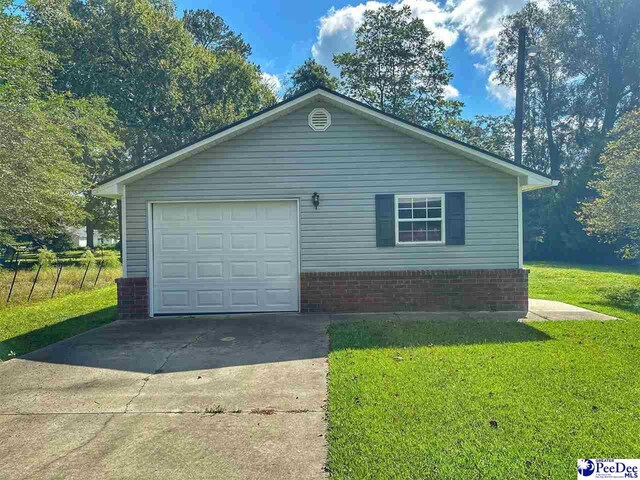 view of property exterior with a lawn