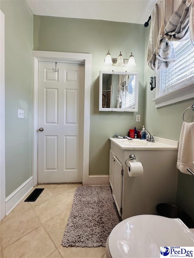 bathroom with vanity and tile patterned floors