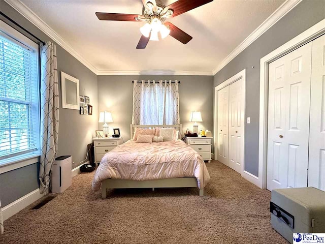 bedroom with multiple windows, ornamental molding, and carpet floors