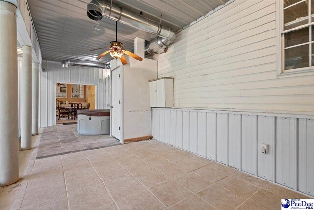 interior space featuring ceiling fan