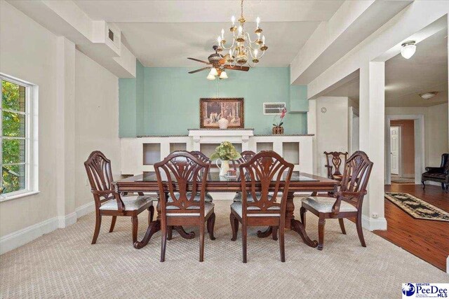 dining room featuring an inviting chandelier and light hardwood / wood-style flooring