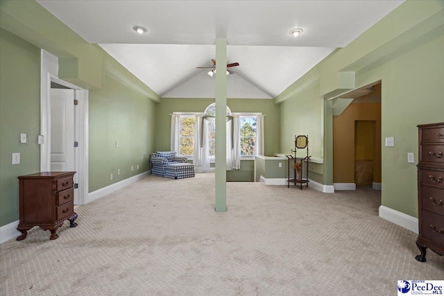 interior space with ceiling fan and lofted ceiling