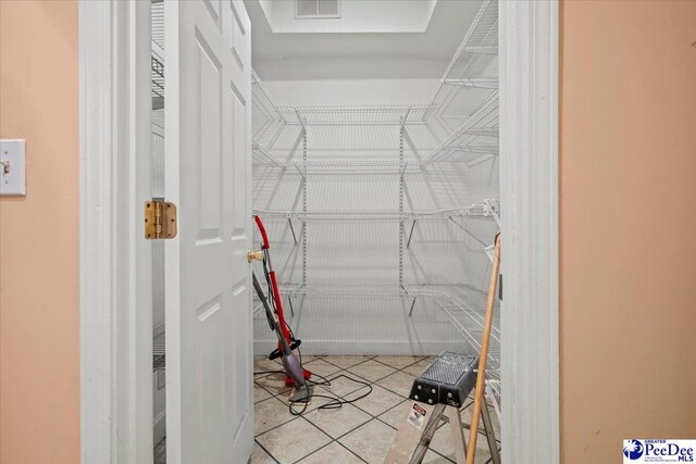 walk in closet featuring light tile patterned floors