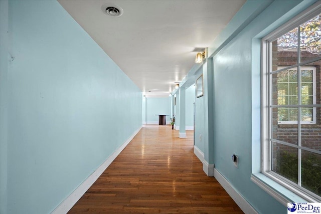 hallway with dark wood-type flooring