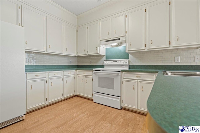 kitchen featuring white appliances, dark countertops, white cabinets, and under cabinet range hood