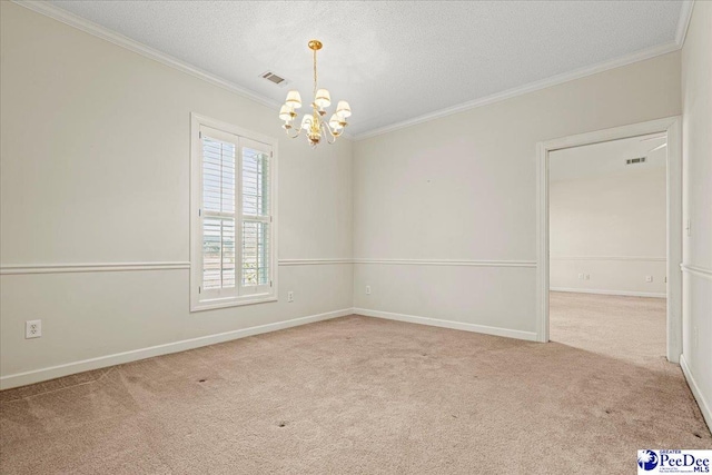 spare room featuring ornamental molding, a chandelier, visible vents, and light carpet