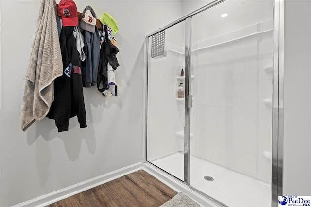 2025 Eastpark Dr, Darlington, SC 29532 - bathroom with baseboards, wood finished floors, and a stall shower